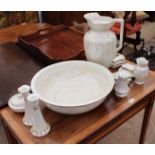 AN EARLY 20TH CENTURY PEARLY LUSTRE WASH SET with wash jug and basin, candle sticks, hat pin stand