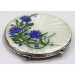 A MID 20TH CENTURY CIRCULAR SILVER ENAMEL DECORATED COMPACT painted with flowers to the front 6.