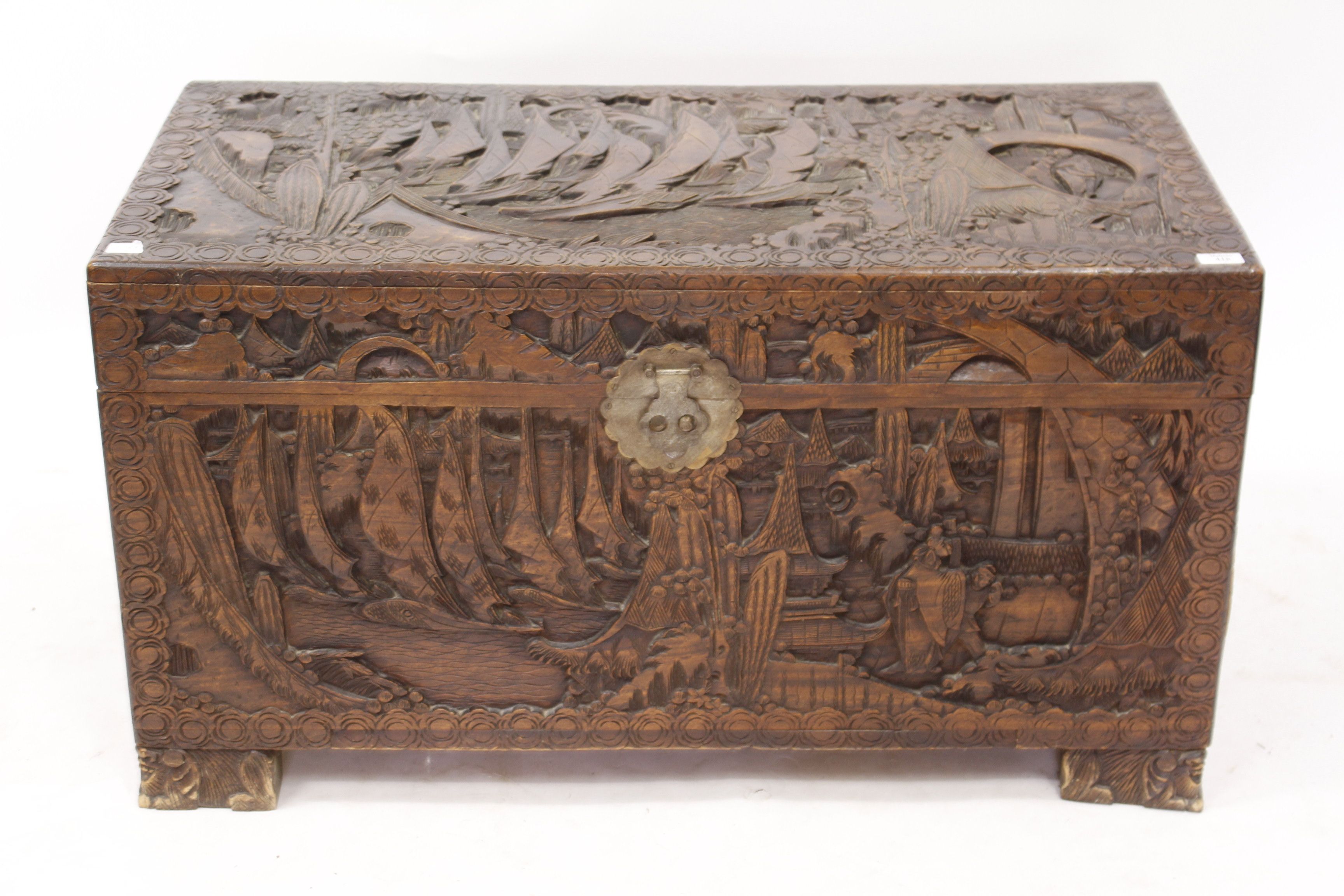 AN EASTERN CARVED TEAK AND CAMPHORWOOD LINED CHEST 103cm wide