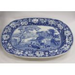 A 19TH CENTURY BLUE AND WHITE MEAT DISH decorated with deer beside a river with a classical temple