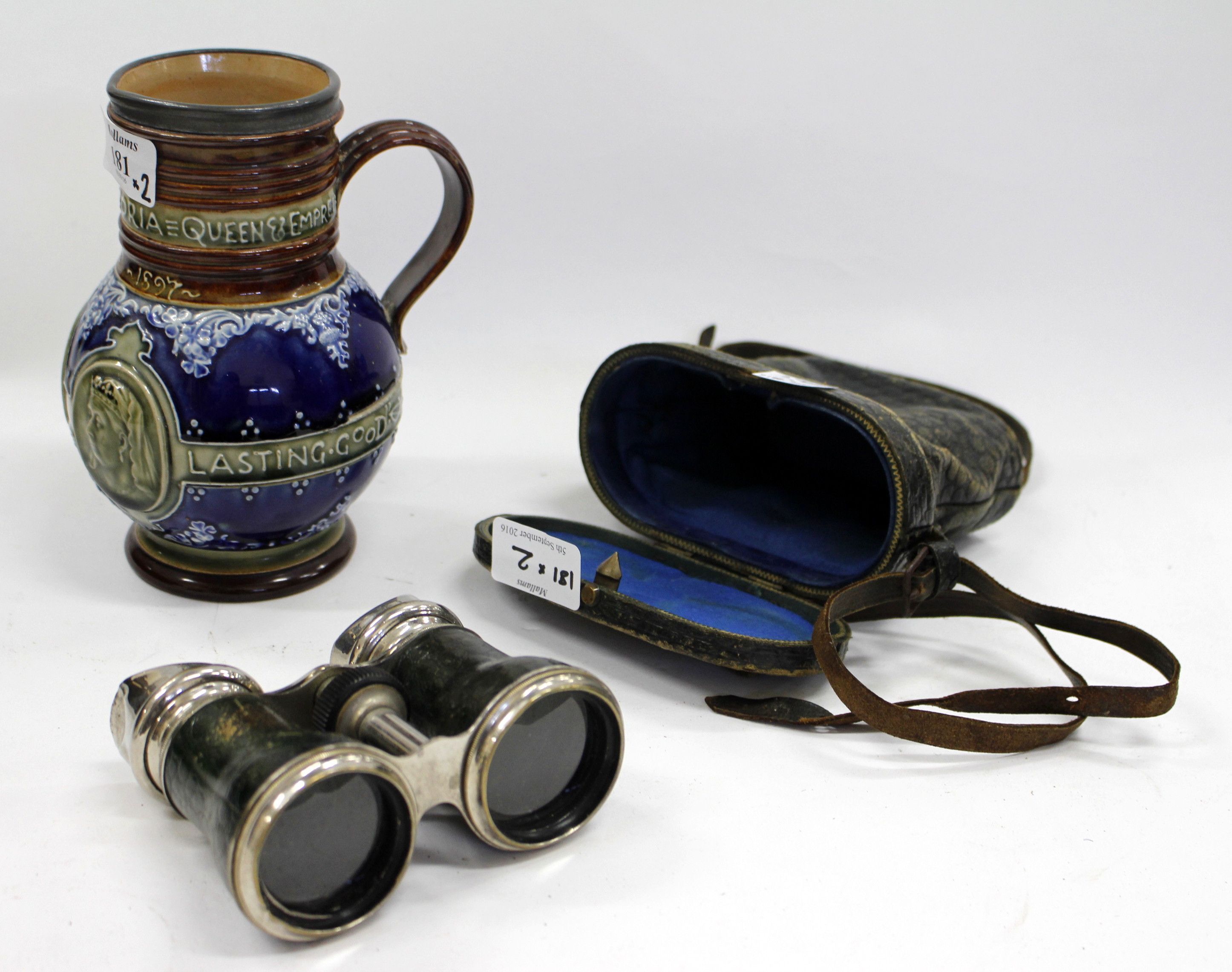 A VICTORIAN ROYAL DOULTON LAMBETH QUEEN VICTORIAN JUG 17cm high and a set of opera glasses in a