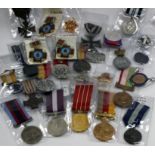 A LARGE SELECTION OF WORLD MEDALS including a World War I German Iron Cross, a World War II medal