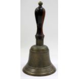 A VICTORIAN GUNMETAL SCHOOL HAND BELL with turned handle and brass knop 23cm high