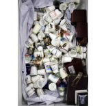 A LARGE COLLECTION OF PORCELAIN, PEWTER AND OTHER THIMBLES to include a Royal Crown Derby thimble