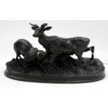 AN ANTIQUE ANMALIE BRONZE after Mene depicting two sheep on a naturalistically moulded base 17cm