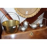 A BRASS JAM PAN and a four piece beaten pewter tudric tea set consisting of a tea pot, a coffee pot,