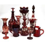 A SELECTION OF RUBY RED ETCHED GLASSWARE and Mary Gregory style glassware, and a Victorian ruby