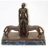 AN ART NOUVEAU STYLE BRONZE FEMALE FIGURE with two dogs, mounted on a stepped hardstone base 48cm