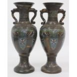 A PAIR OF CHINESE CLOISONNE BRONZE VASES with urn shaped body, splayed foot and decorated with