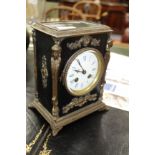 A 19TH CENTURY FRENCH EBONISED MANTLE CLOCK with gilt metal mounts, the enamelled dial with Roman