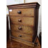 A VICTORIAN MAHOGANY TABLE TOP CHEST OF FOUR DRAWERS with turned knob handles and a plinth base,