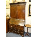 A GEORGIAN OAK BUREAU BOOKCASE