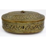 A CHASED AND ENGRAVED OVAL MIDDLE EASTERN BRASS CASKET with ring handle to the lid 23cm wide