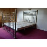 A SILVERED BRASS DOUBLE BED with spindle end panels and knopped finials