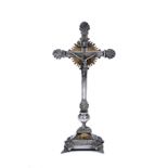 A CONTINENTAL CAST WHITE METAL CRUCIFIX with brass mounts, 16.5cm wide x 34.5cm high