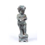 AN OLD CAST IRON SCULPTURE OF A CHERUB playing a lute, 28cm in height