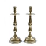 A PAIR OF MID TO LATE 19TH CENTURY BRASS KNOPPED CANDLESTICKS with drip pans, initialled to the