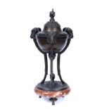 A OLD CONTINENTAL BRONZED SPELTER LIDDED SENSOR decorated with ram's masks and on three legs