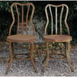 A PAIR OF OLD CONTINENTAL WROUGHT IRON CAFE CHAIRS with circular seats, 40cm wide x 89.5cm high (2)