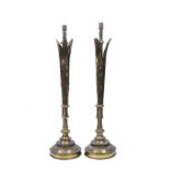 A PAIR OF VICTORIAN LACQUERED BRASS TORCHERES in the Gothic revival style, the stems mounted with