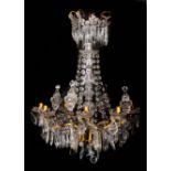 A FINE CUT GLASS AND GILT METAL TWELVE BRANCH, EIGHT LIGHT HANGING CHANDELIER with numerous facet