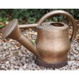 A LIMITED EDITION FRENCH COPPER WATERING CAN of bulbous form with strap handle, signed to the bottom