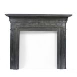 A VICTORIAN POLISHED CAST IRON FIRE SURROUND in the neo classical style with shaped mantelpiece, the