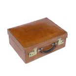 A TAN LEATHER DRESSING CASE by J W Benson Ltd, Ludgate Hill, London with brass locks, 43cm wide