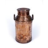 AN OLD COPPER MILK CHURN with loop handles, 60cm high