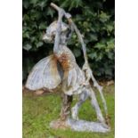 A PAINTED CAST IRON SCULPTURE of a fairy pulling on a branch, 59cm high