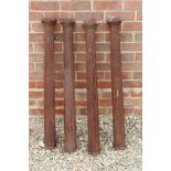 A SET OF FOUR CAST IRON FLUTED COLUMNS of classical form, each 10cm square and 92cm high (4)