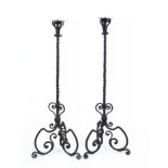 A PAIR OF ANTIQUE CONTINENTAL WROUGHT IRON FLOOR STANDING ECCLESIASTICAL CANDLESTICKS with spiral