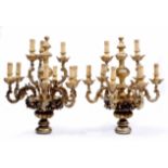 A PAIR OF ANTIQUE NINE BRANCH CARVED GILT WOOD ITALIAN LIGHTS, carved with fruiting berries