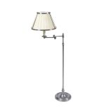 A LATE 20TH CENTURY CHROME PLATED FLOOR STANDING READING LAMP with hinged adjustable lamp and