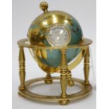 A LATE 20TH CENTURY DESK TIMEPIECE in the form of a terrestrial globe and stand, the eight day