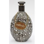 A GLASS DECANTER of triangular lobed form with 950 grade silver bamboo leaf overlaid decoration, a