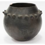 A POSSIBLY AFRICAN DARK BROWN GLAZED VESSEL of gourd form with spiked decoration 16cm in height