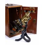 AN OLD J. SWIFT & SON, LONDON, BLACK LACQUERED MICROSCOPE with adjustable platform in a fitted