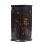 AN 18TH CENTURY CHINOISERIE LACQUERED BOW FRONT CORNER CABINET, brass butterfly hinges, 56cm wide