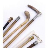 A GROUP OF SEVEN ANTIQUE RIDING CROPS to include one by Swaine & Co., (7)