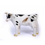 A PAPER MACHE COW 90cm long x 63cm high