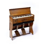 AN EARLY 20TH CENTURY KEYBOARD ORGAN in carrying box 72cm