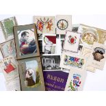 AN ALBUM of early 20th Century postcards, a small collection of greetings cards and a further