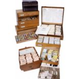 A GROUP OF WATCH PARTS to include joules, pinions, springs etc. in three drawer storage case and