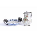 A 18TH CENTURY DUTCH DELFT BLUE AND WHITE STRAINER DISH with silver handles, 19cm diameter; and a