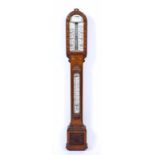 A VICTORIAN OAK CASED STICK BAROMETER with porcelain dials and carved decoration, indistinctly