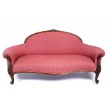 A 19TH CENTURY MAHOGANY FRAMED SOFA with arching back, carved scrolling legs 186cm wide