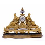 A 19TH CENTURY FRENCH GILT METAL CLOCK mounted with two figures and porcelain panels on a shaped