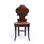 A GEORGE III MAHOGANY HALL CHAIR with oval seat 43cm wide x 90cm high