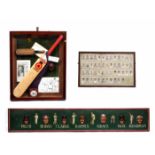 A PAINTED WOODEN CRICKET ADVERTISING PANEL depicting famous cricketers, 31cm x 185cm; a group of